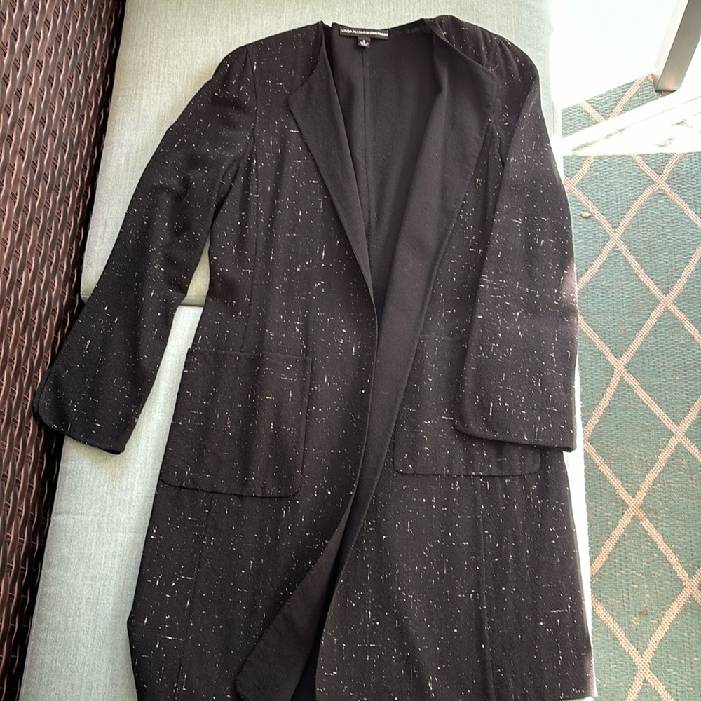 Elegant tunic, wool, black with white specks. Makes any outfit dressier.
